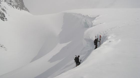 Backcountry skiers climb Selkirk Mountains, BC.